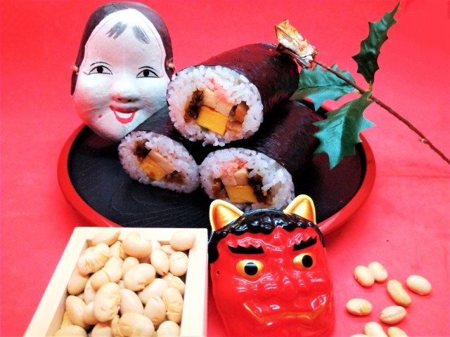 恵方巻き(豆、お多福、鬼の面、柊鰯)の画像